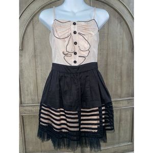 Rockabilly dress in cream color with a black bottom with a sheer look